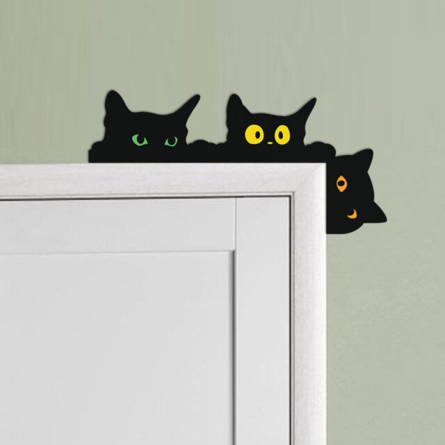 Funny peeking blackcats door corner 